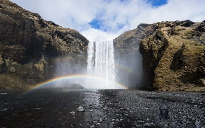 rainbow over a magical waterfall